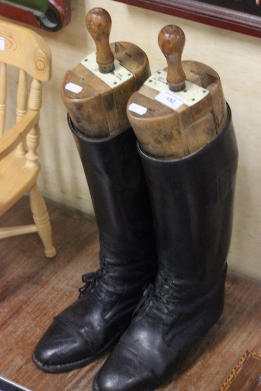 Pair of hunting boots with trees