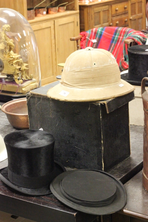 Old pith helmet and boxed top hat with additional folding top hat