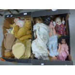 A collection of teddies and dolls