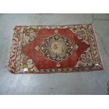 A small decorative prayer rug