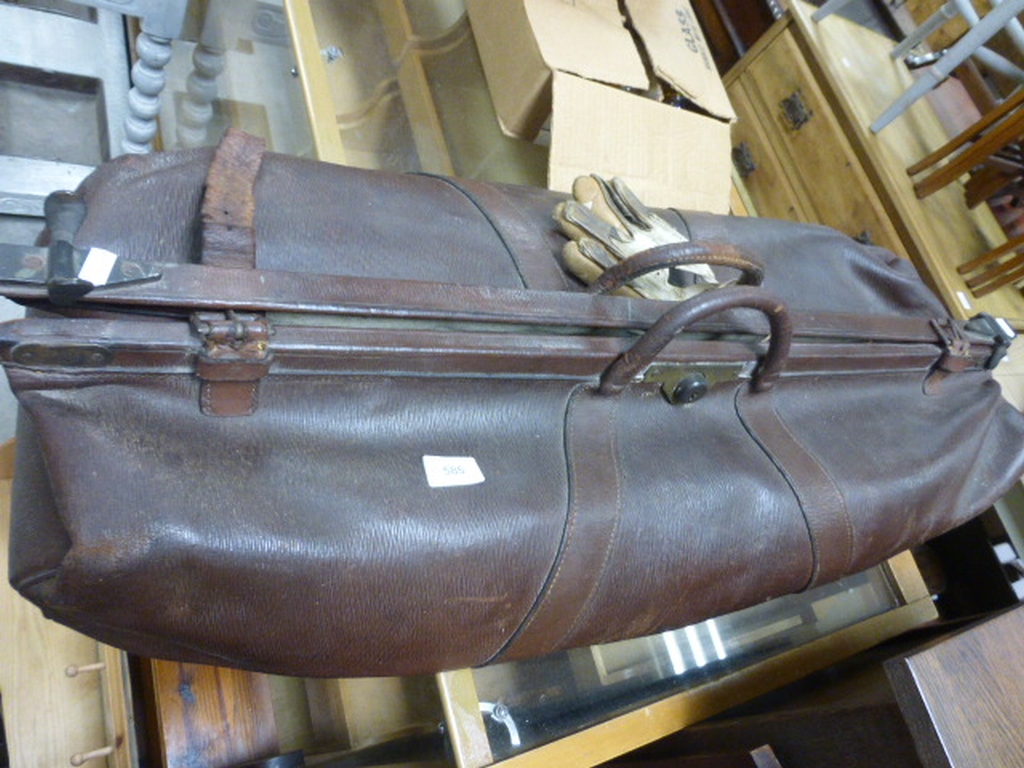A vintage leather cricket bag