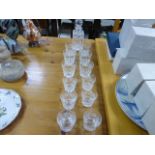 A Royal Doulton decanter, along with 12 glasses, each with a etched mark