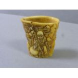 Bone cup decorated with old man and animals