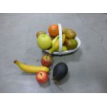 Assortment of decorative fruit in bowl