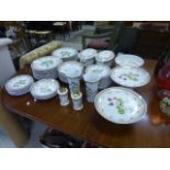 A large ceramic dinner service each piece decorated various flowers