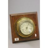 Vintage brass cased barometer on oak backing, Norie & Wilson London