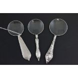 Three Magnifying Glasses with White Metal Handles