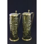 A pair of early 20th century brass narrow tankard each decorated with cavaliers