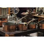 Seven various copper saucepans