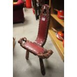 Wooden birthing chair with red leather