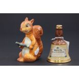 A Beswick red Squirrel, along with a miniature Bells whisky