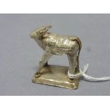 An early 20th century middle eastern silver miniature model of a bull, unmarked