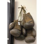 Two pairs of vintage leather boxing gloves