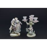 A Meissen style figure of a couple, along with a a three branch candelabra