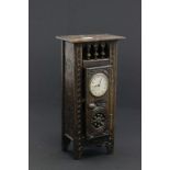 Miniature wardrobe with inserted clock