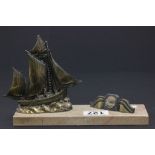 A French spelter card holder, with a model of a ship