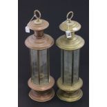 2 candle holders, one brass, one copper, both with cut glass side panels