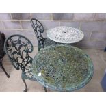 Two metal garden bistro tables and two chairs