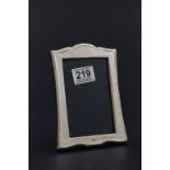 A silver picture frame with easel back