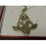 A silver and opal art nouveau style pendent necklace