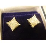 A pair of 10th century W/G diamond cluster earrings