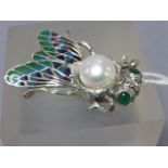 An unusual silver and enamel bug brooch with silver pearl