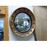 A regency style convex mirror in a gilt surround