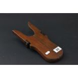 A mahogany folding boot jack