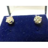 A pair of W/G diamond studs of 85 points