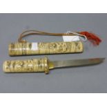 A 20th century Japanese dagger in a bone scabbard