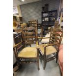 Two Oak Ladder Back Elbow Chairs with String Seats