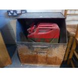 Two vintage red jerry cans, along with a metal store bin and camp bed