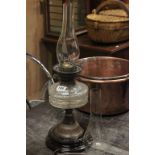 An Edwardian glass oil lamp