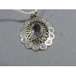 White Metal and Enamelled Pendant set with Amethyst Coloured Stone