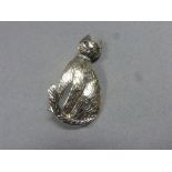 Silver brooch in the form of a seated cat