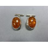 Pair of silver and amber cufflinks