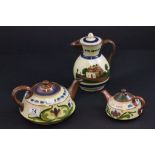 Two motto ware teapots, along with a motto ware coffee pot