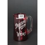An early 20th century red glass whisky water jug, advertising Dawsons perfection Whisky