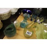 A early 20th century/late 19th century blue glass jug, along with green glass jug and a one other