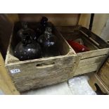 Two vintage wooden crates, along with a hanging light and three glass jars