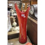 A large red decorative vase