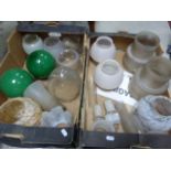 A collection of glass lamp shades, funnels etc