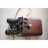 A pair of Carl Zeiss binoculars in a leather case