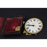 A gilt mounted clock in a leather case, by H.W.Bedford & Company, London