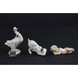 A Lladro figure of a sleeping boy, along with figure of dog and duck