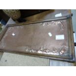 A copper tray mounted in an oak frame, with ivy leaf design, with a makers mark to the corner