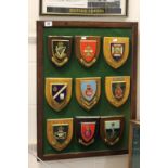 A collection of nine naval/military wooden shields