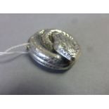 A silver vesta case in the form of a snake