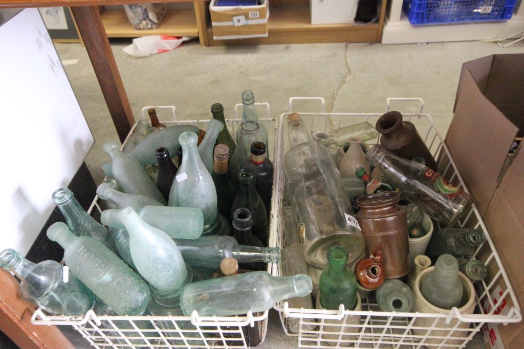 A collection of glass bottled and stoneware