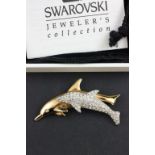 A Swarovski dolphin brooch